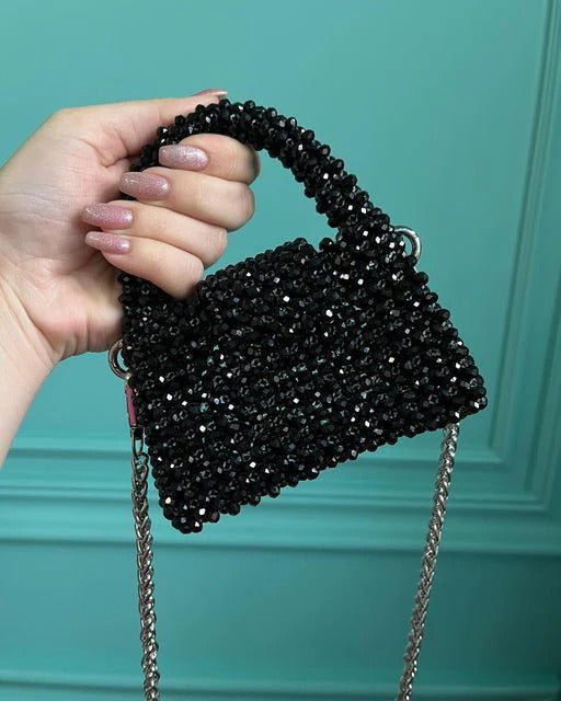 Elegant black beaded clutch – Celesté front angle view