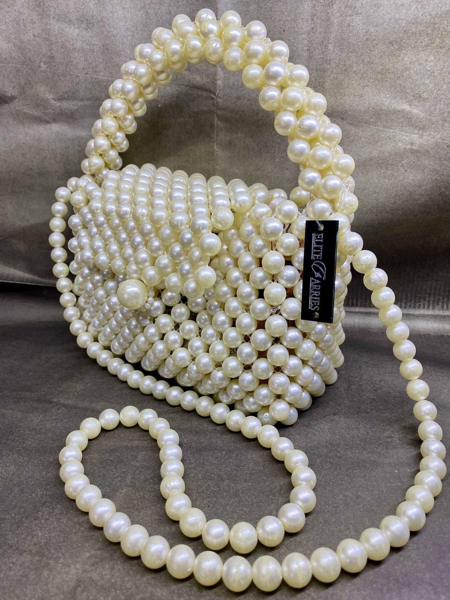 Side view of Ocean Pearl pearl-beaded bag with chain strap