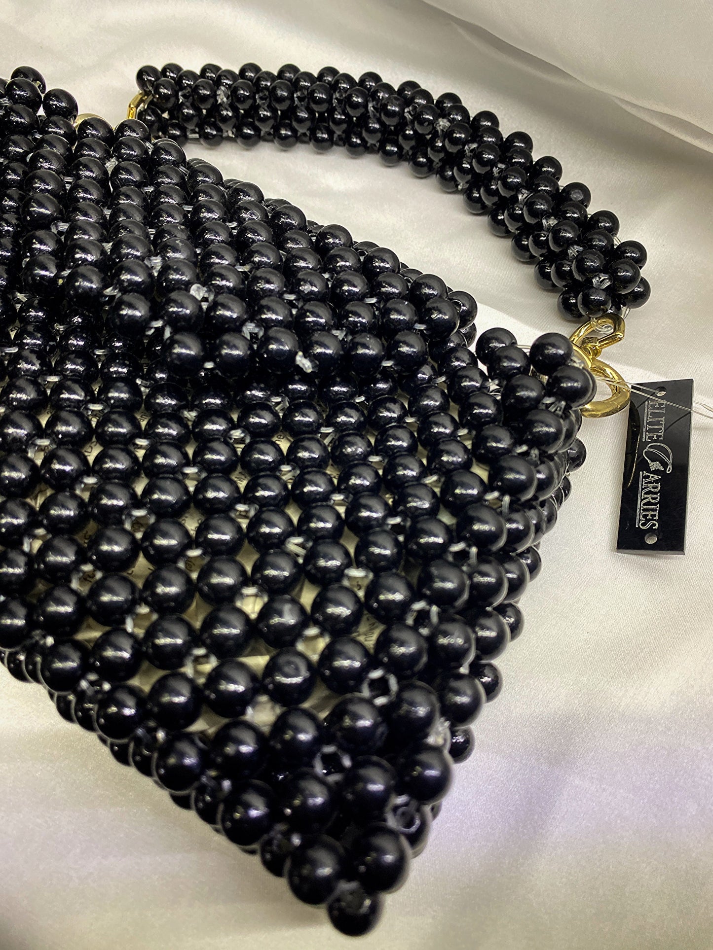 Side view of Pearl Noir – classic pearl purse for formal wear