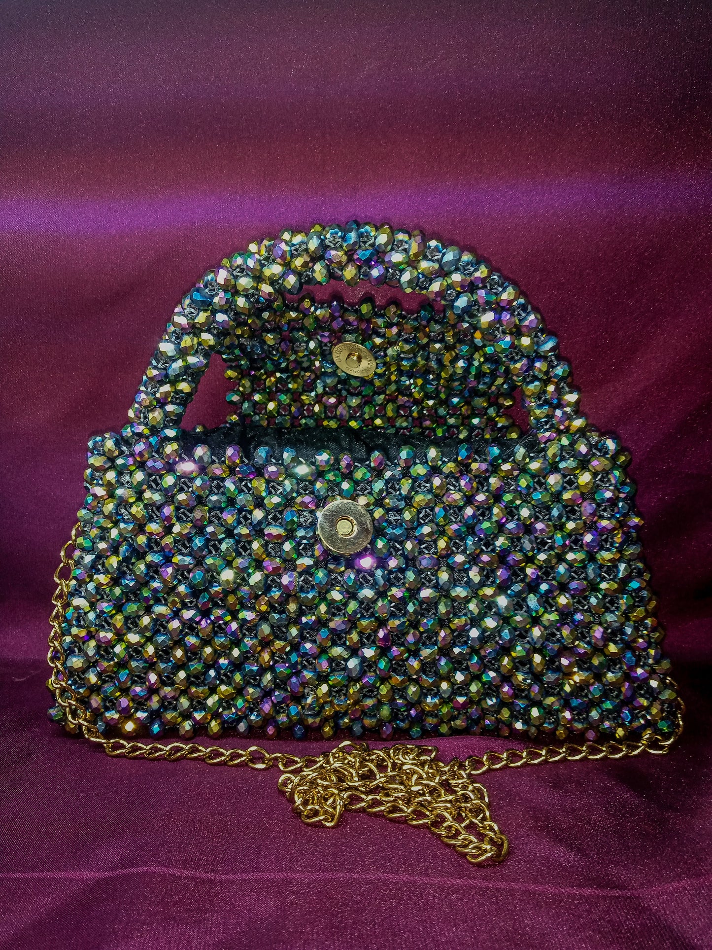 A stunning multi-colored crystal handbag named Aurora Luxe Bag, perfect for evening wear.