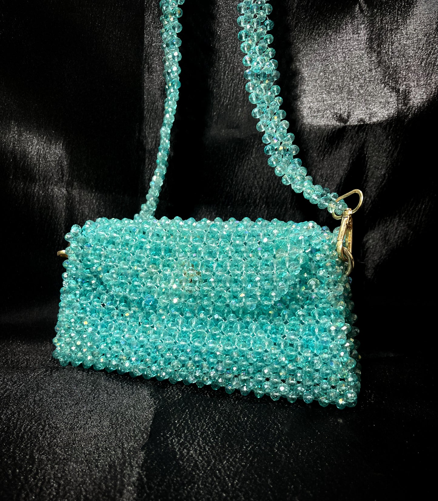 Shimmering blue crystal clutch with a luxurious handcrafted finish – ideal for elegant evenings