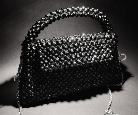 Handcrafted Pakistani women’s bags with pearl and crystal beads, showcasing detailed craftsmanship and cultural elegance.