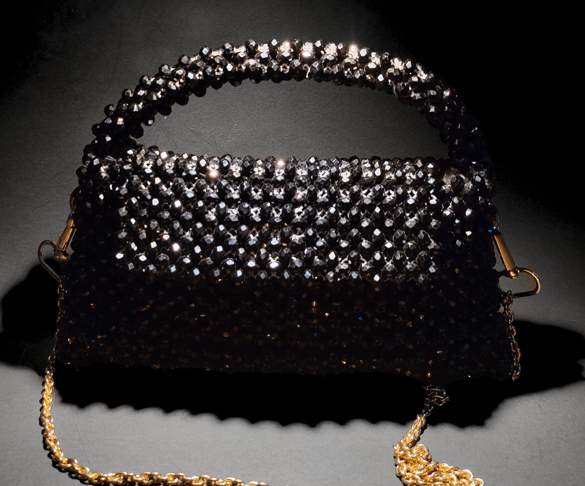 Artisan-crafted pearl and crystal beaded bags from Pakistan, featuring intricate designs for a sophisticated, cultural look.