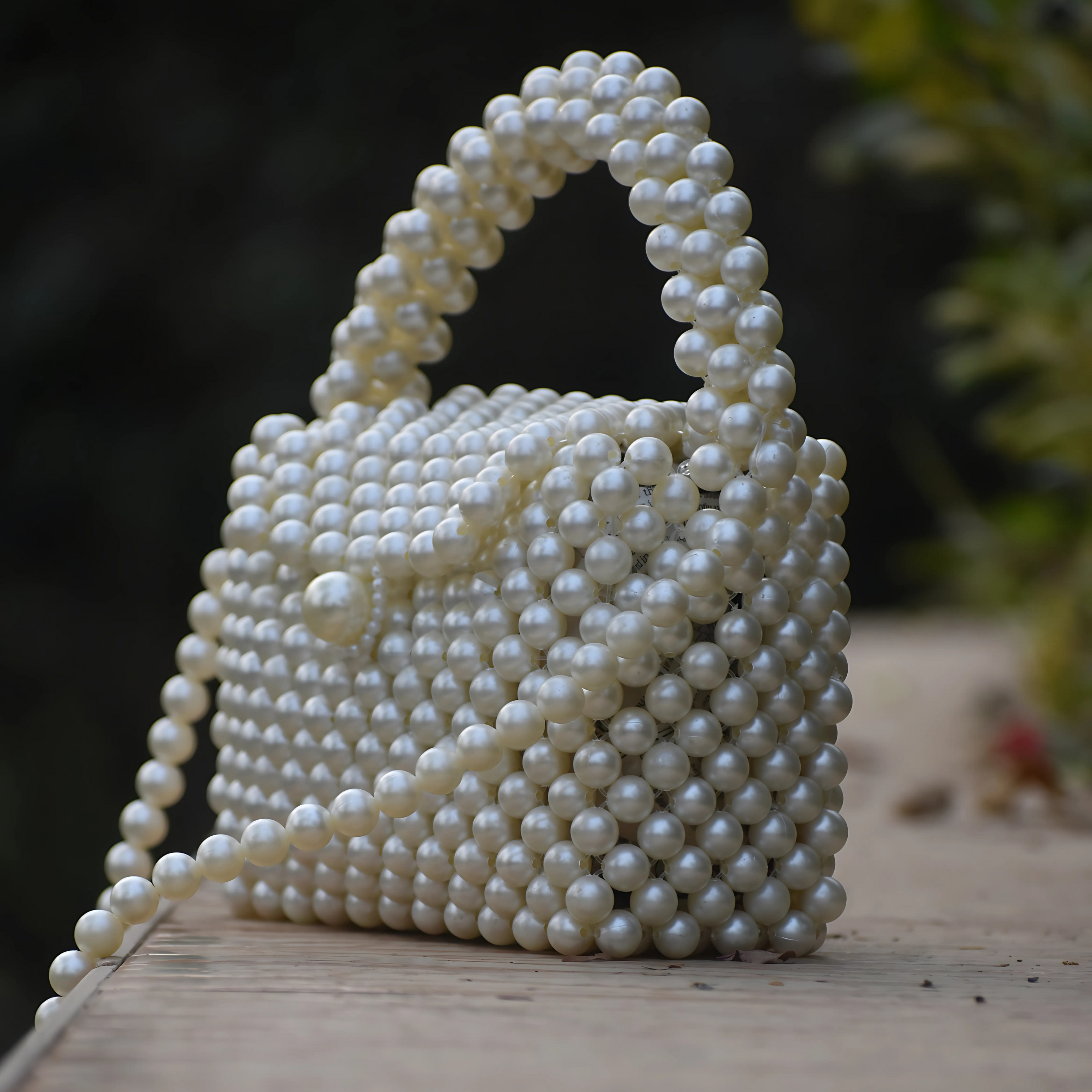 Closeup of pearl beading detail on Ocean Pearl clutch