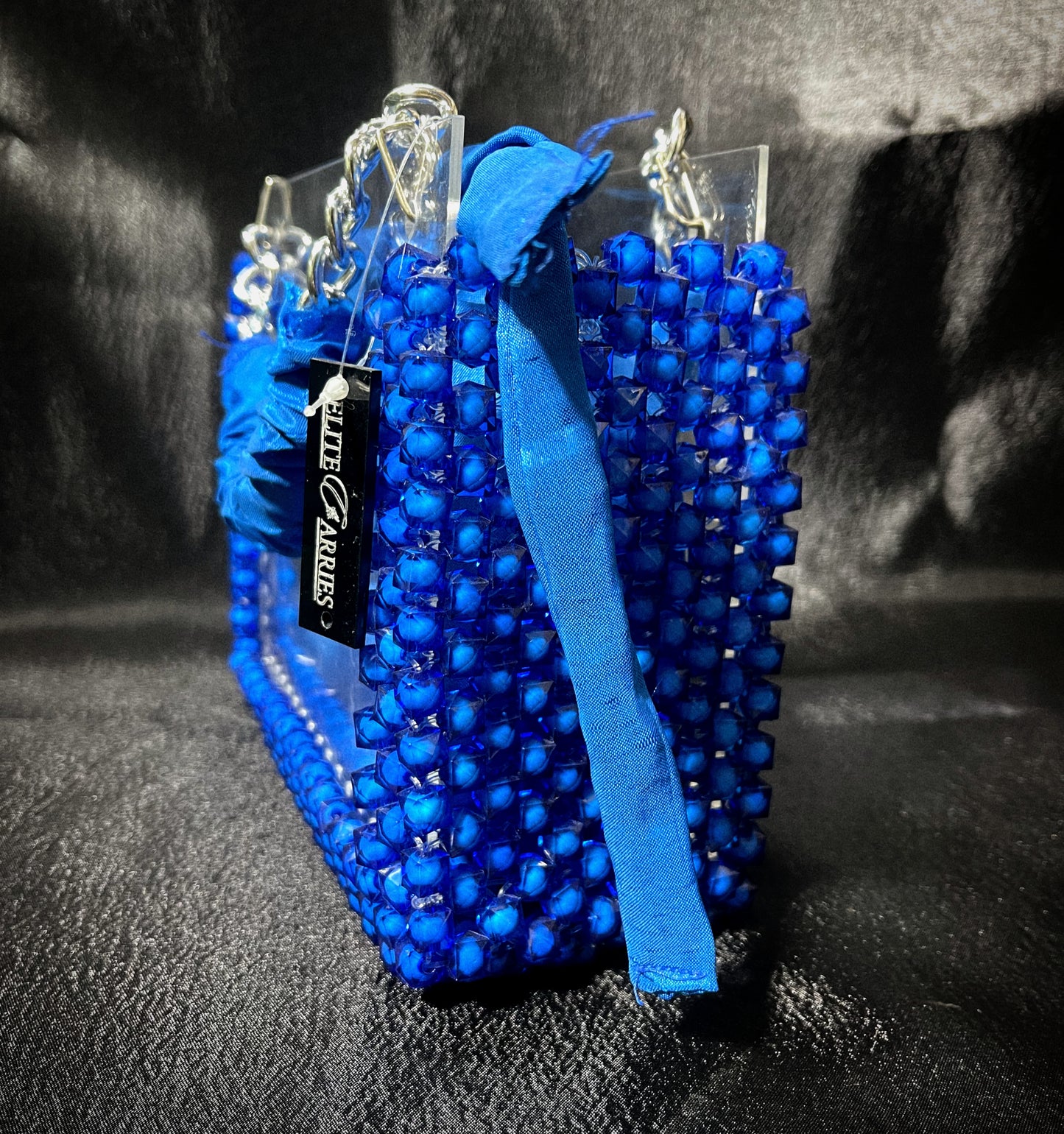 A dazzling handmade blue glass handbag, crafted for luxury and timeless charm