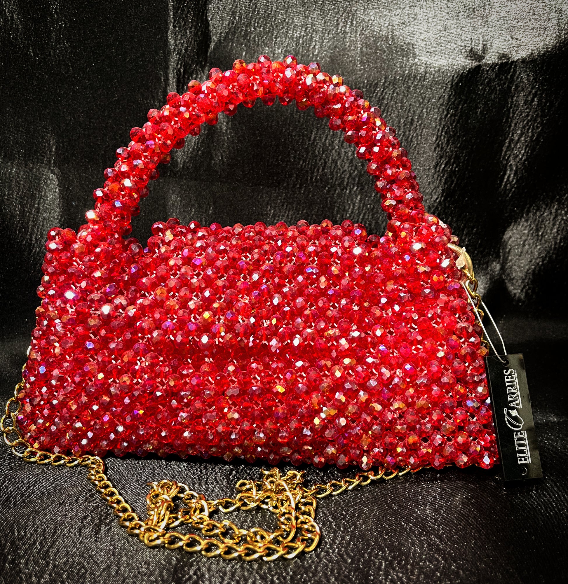 Elegant handcrafted red glass purse, perfect for adding a bold statement to any outfit.
