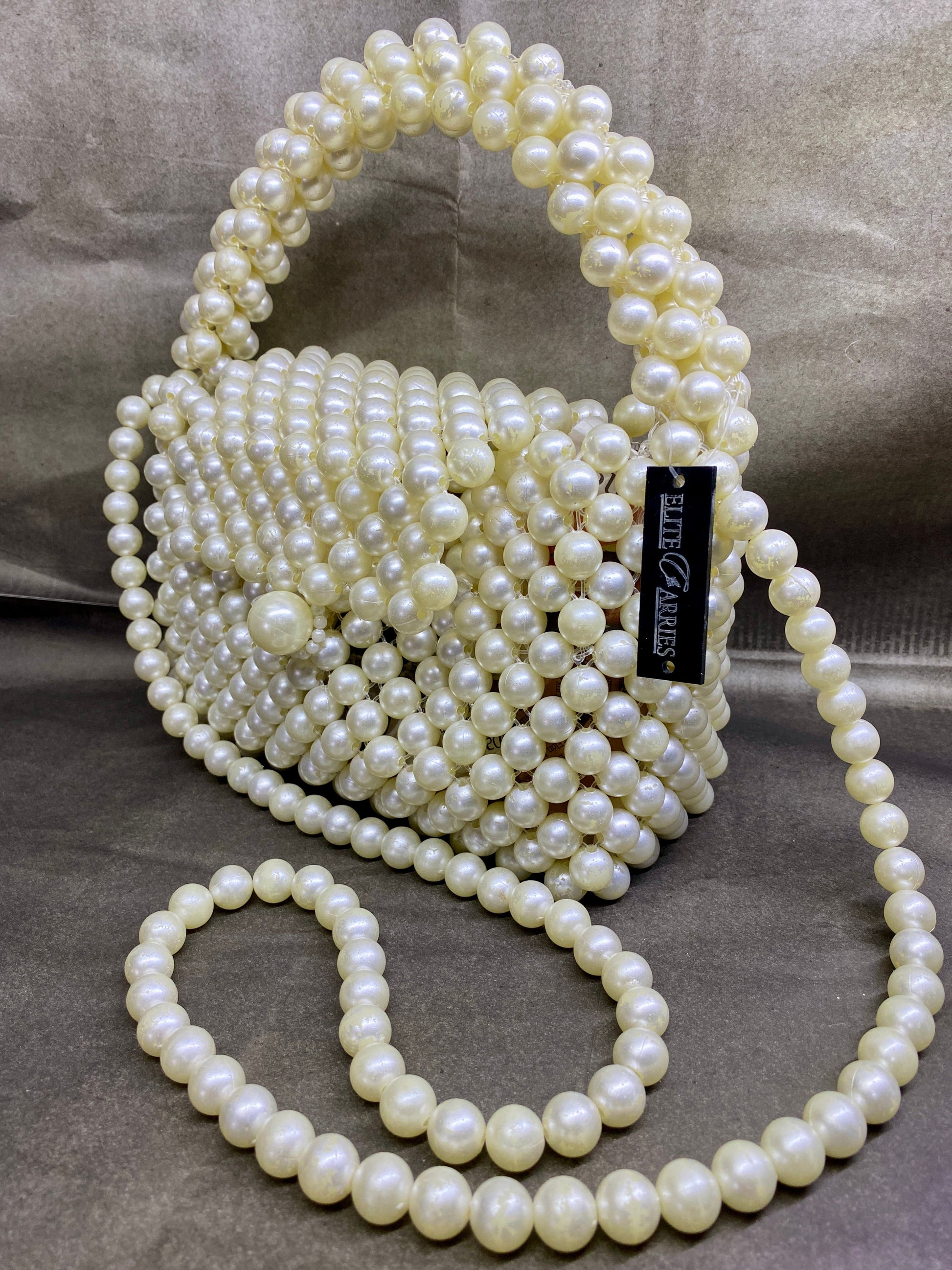 Side view of Ocean Pearl pearl-beaded bag with chain strap