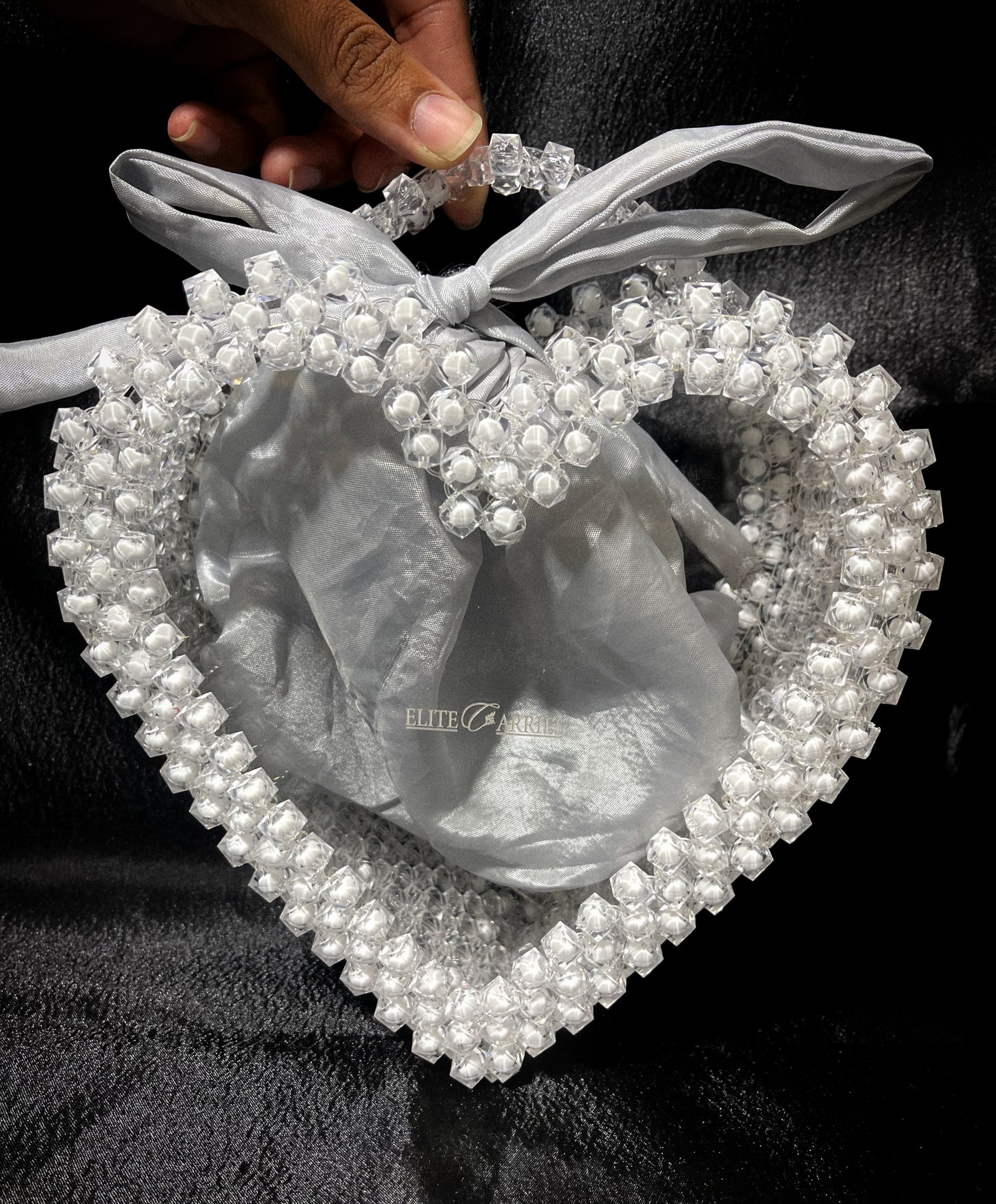 A sophisticated white glass heart bag, shining with luxury and charm