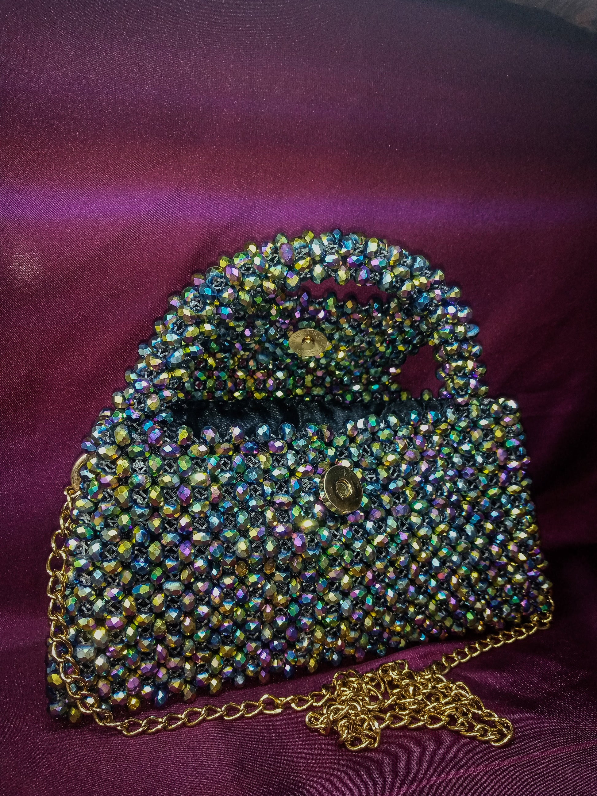 Luxurious Prism Glow Purse featuring dazzling crystal beads with a metallic shine.