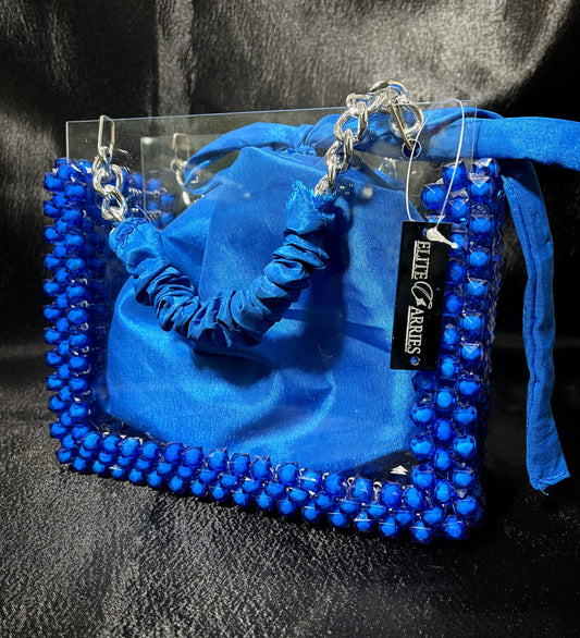 A radiant blue glass purse, featuring a chic handle and a mesmerizing glow