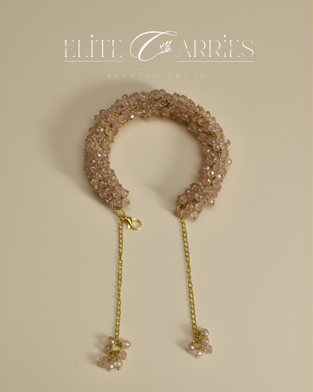 Decorative headband with beads and a chain on a beige background, branded 'Elite Carries'.