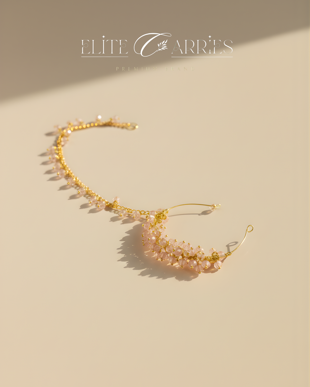Gold headband with pink beads on a beige background, featuring the brand 'Elite Carries'.