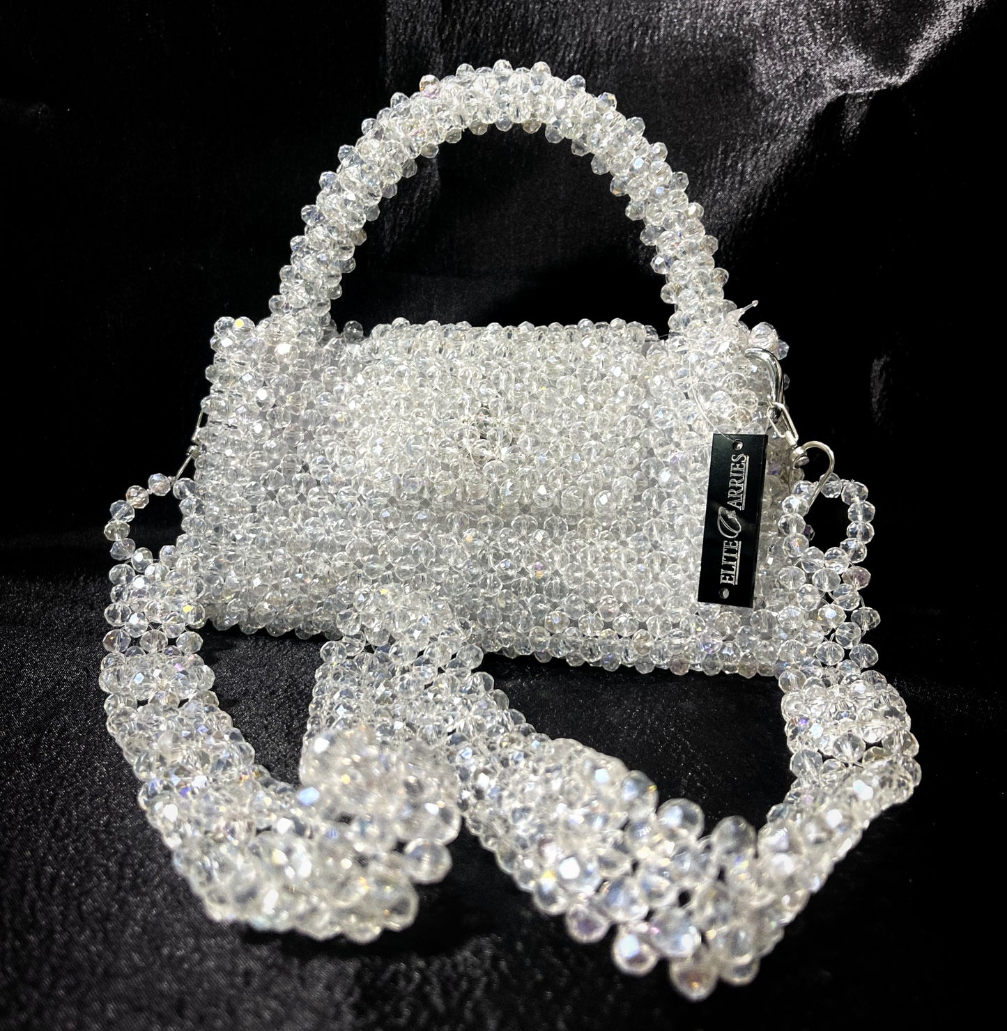 A delicate small white handbag with a crystal-like shine, perfect for elegant styling